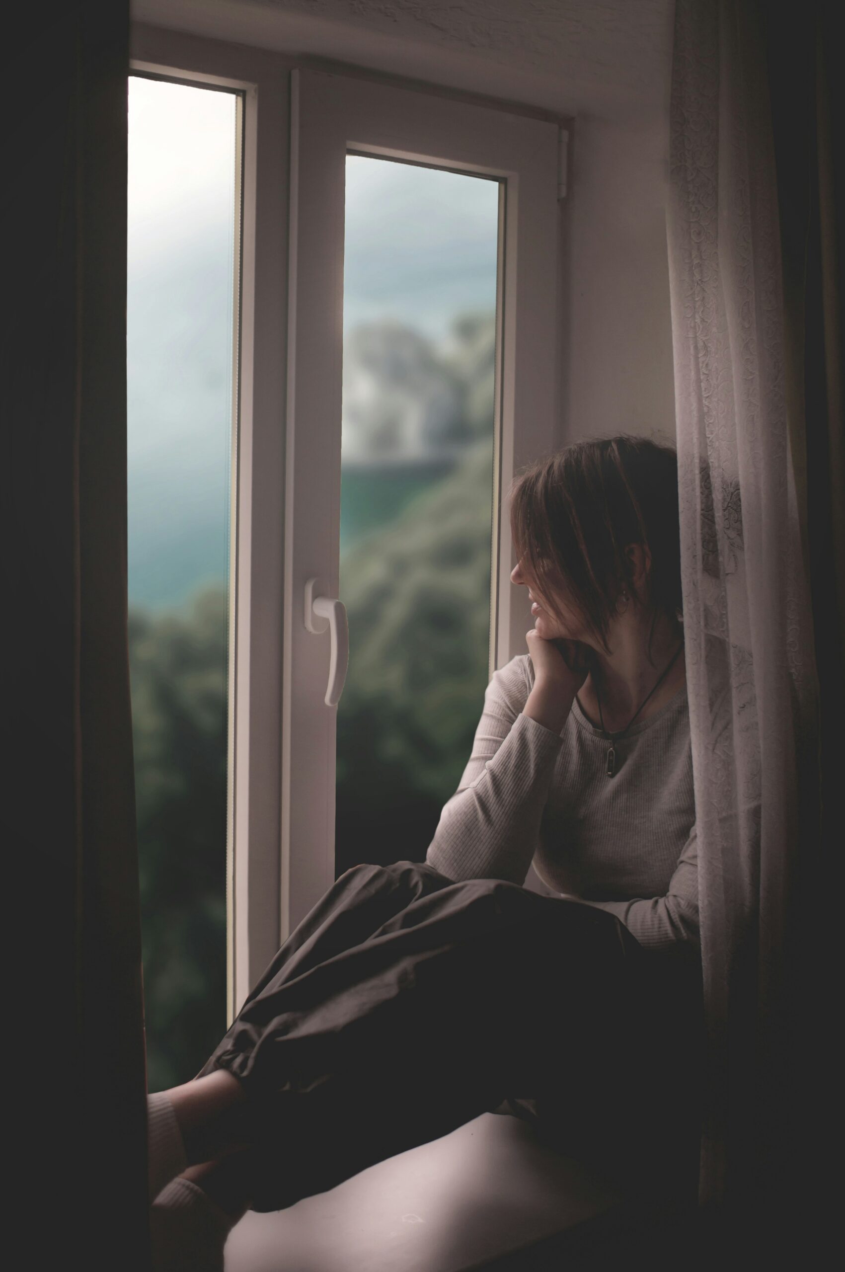 woman starring out window