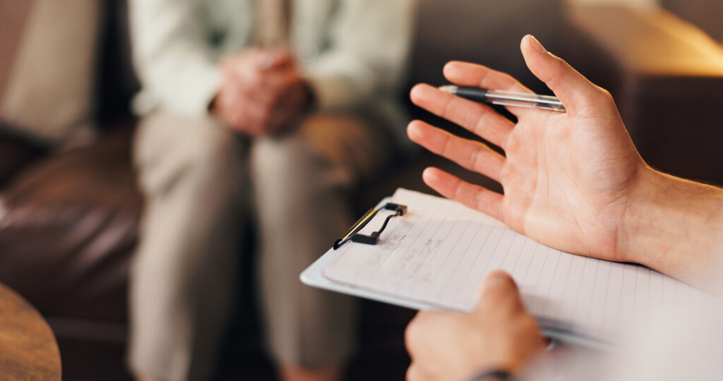 Therapist, patient or hands with notes in office, mental health support or assessment for counseling. Psychology, consultation or person with advice for client, explain coping mechanism or clipboard.